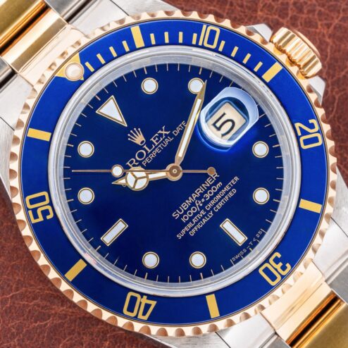 16613 Submariner Date (blue/purple / unpolished / caseback sticker / box and papers)